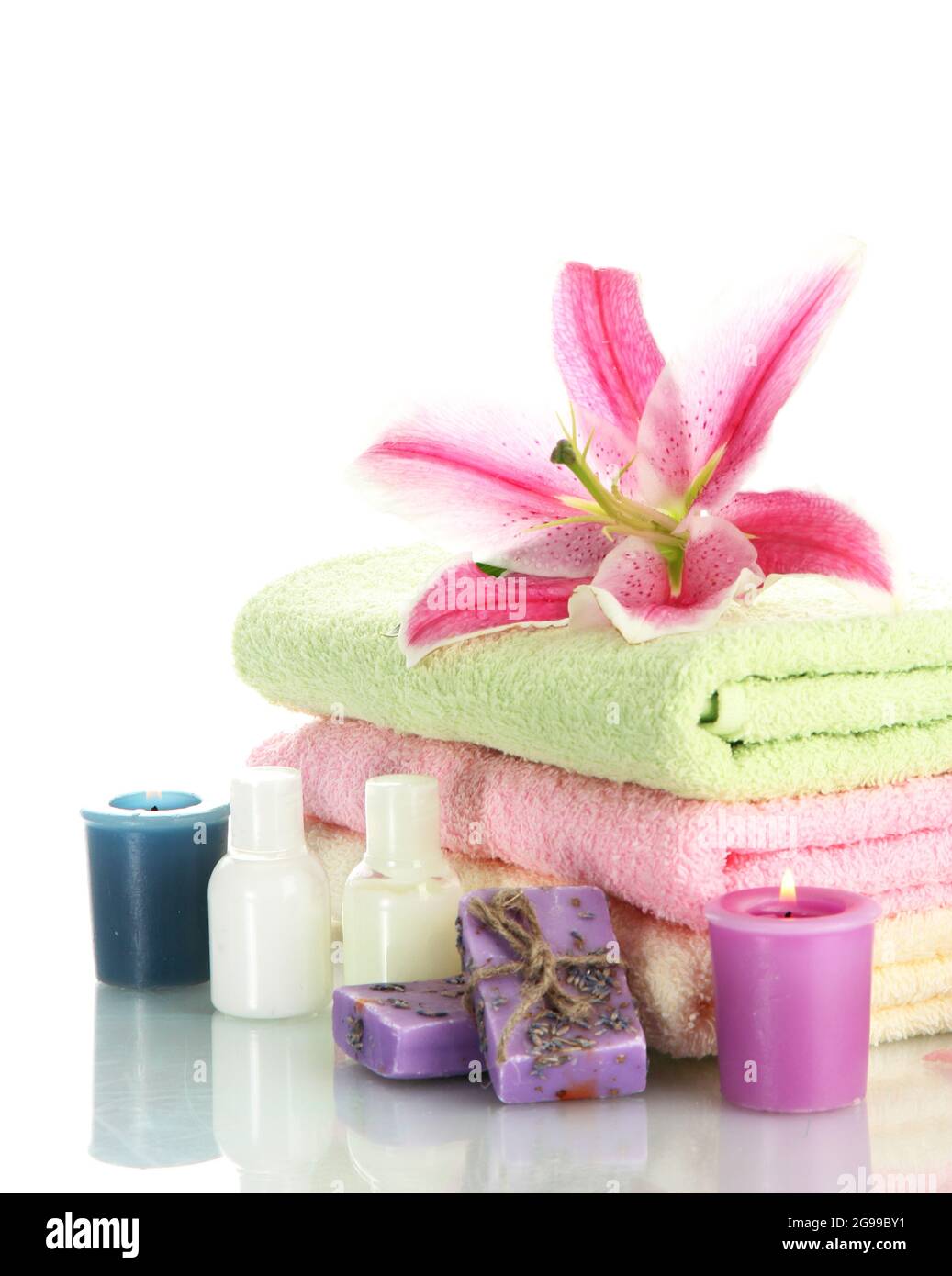 towels with lily, aroma oil, candles and soap isolated on white Stock