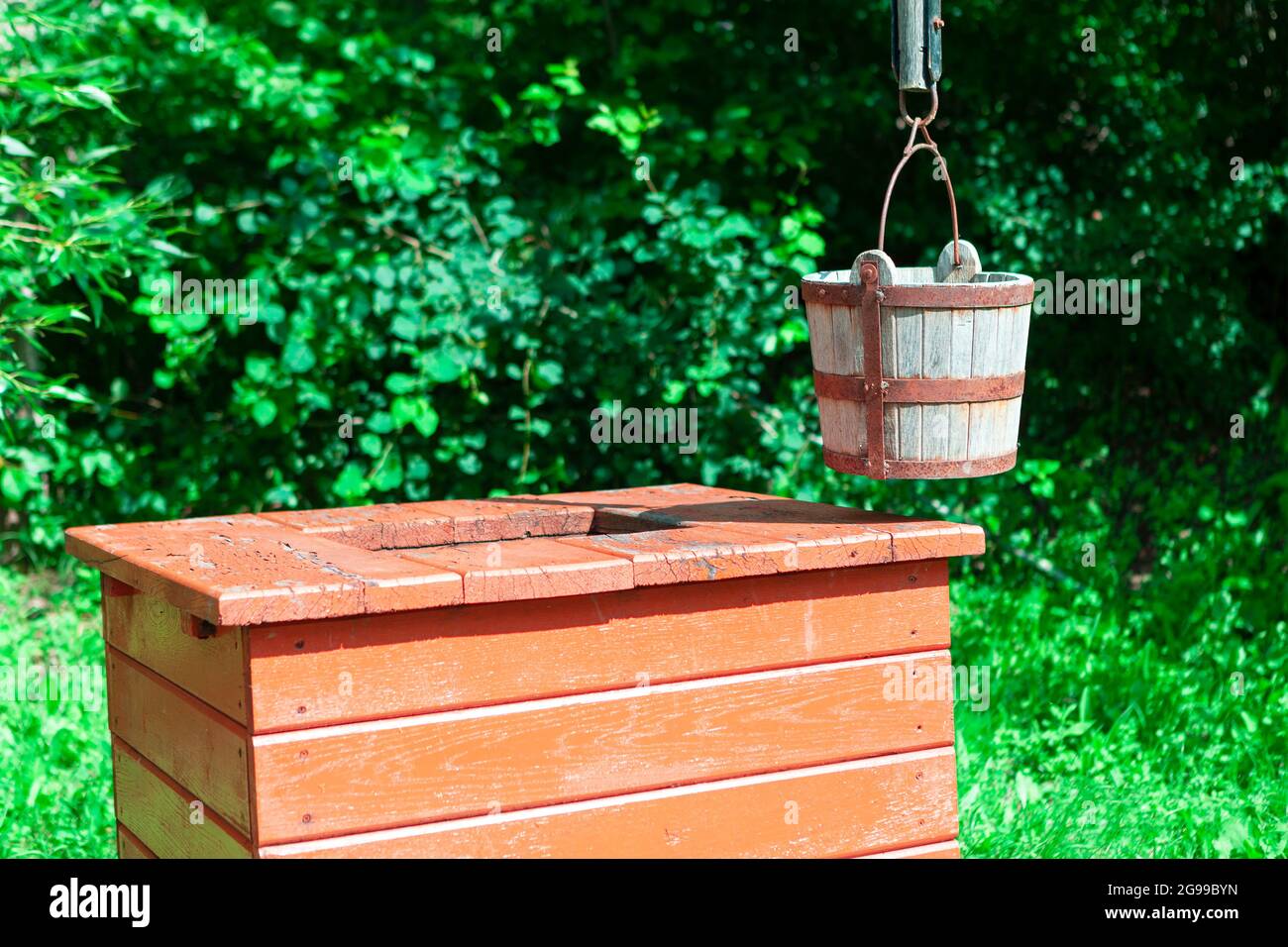 Well with wooden bucket . Drinking water source Stock Photo Alamy