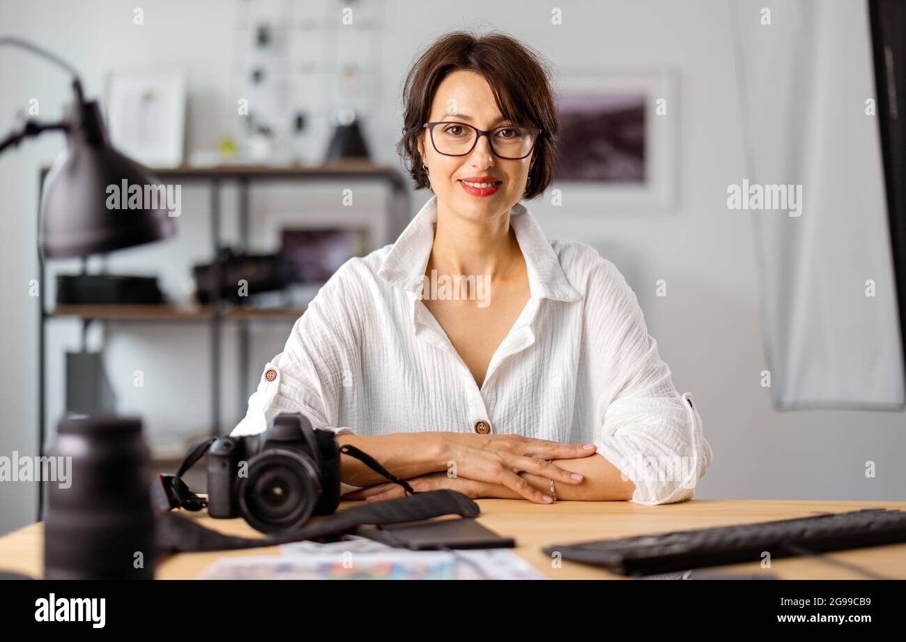 Photographer working at office Stock Photo