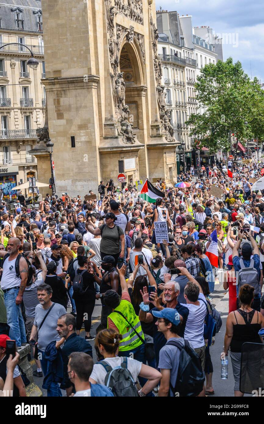 Thousands of demonstrators march through the streets of Paris to protest against the health pass, on July 24, 2021, in Paris, France. Since July 21, people wanting to go to in most public spaces in France have to show a proof of Covid-19 vaccination or a negative test, as the country braces for a feared spike in cases from the highly transmissible Covid-19 Delta variant. Photo by Kelly Linsale / BePress/ABACAPRESS.COM Stock Photo
