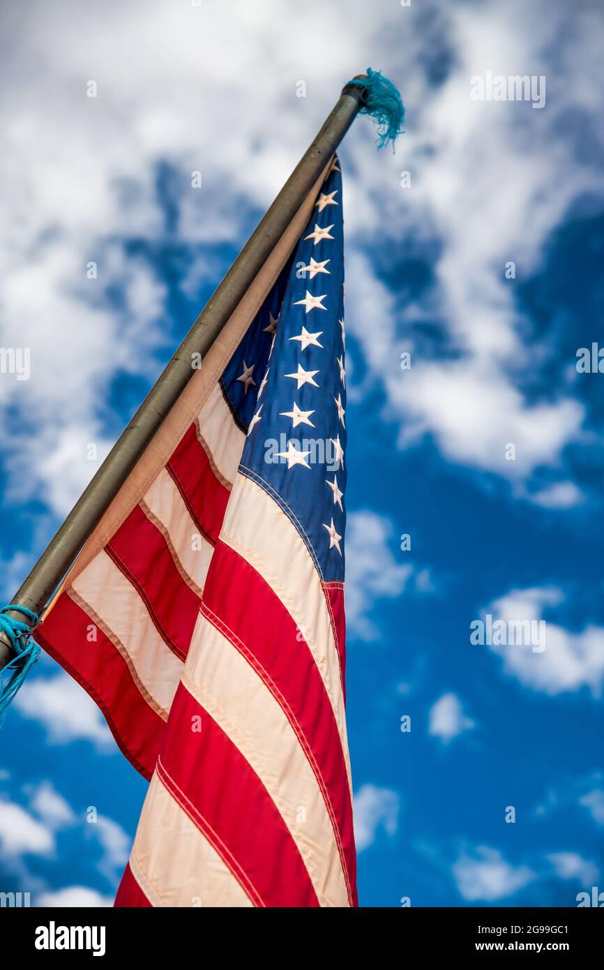 American flag against the blue sky Stock Photo - Alamy