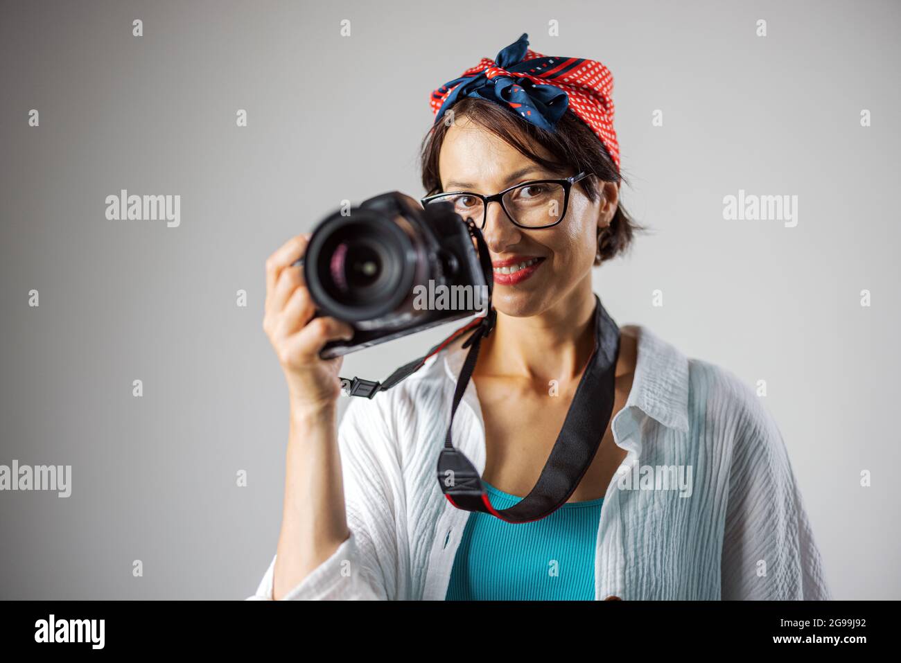 Photographer with camera at studio Stock Photo