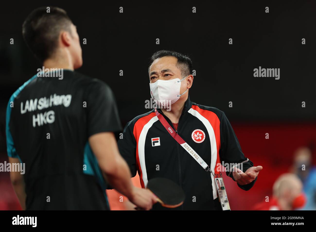 Tokyo, Japan. 25th July, 2021. Liu Guodong (R), coach of Chinese Hong ...