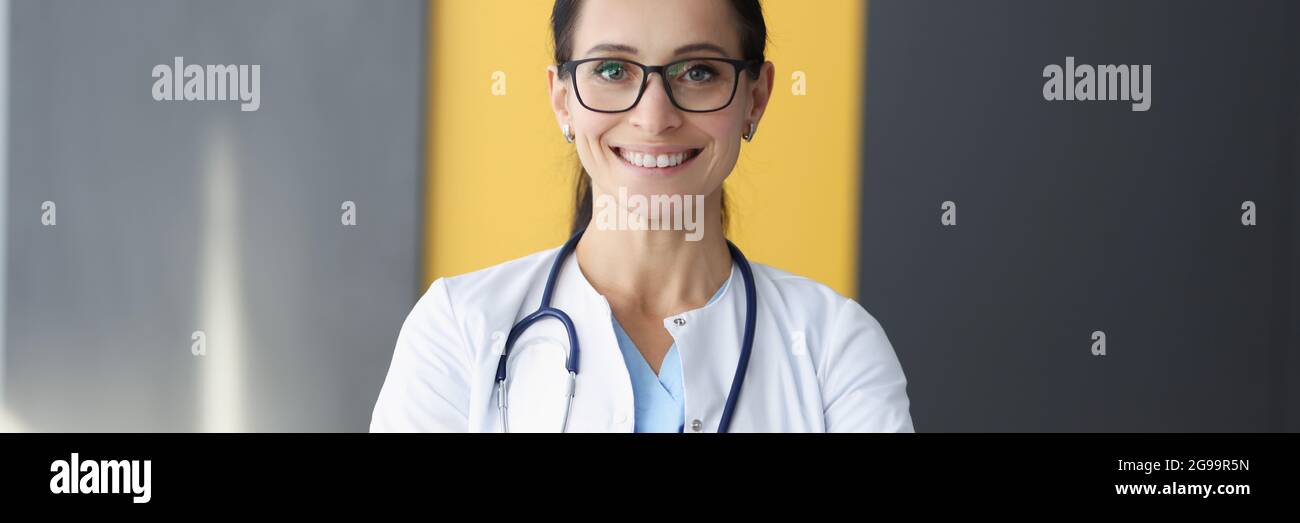 Smiling doctor gp in white hi-res stock photography and images - Alamy