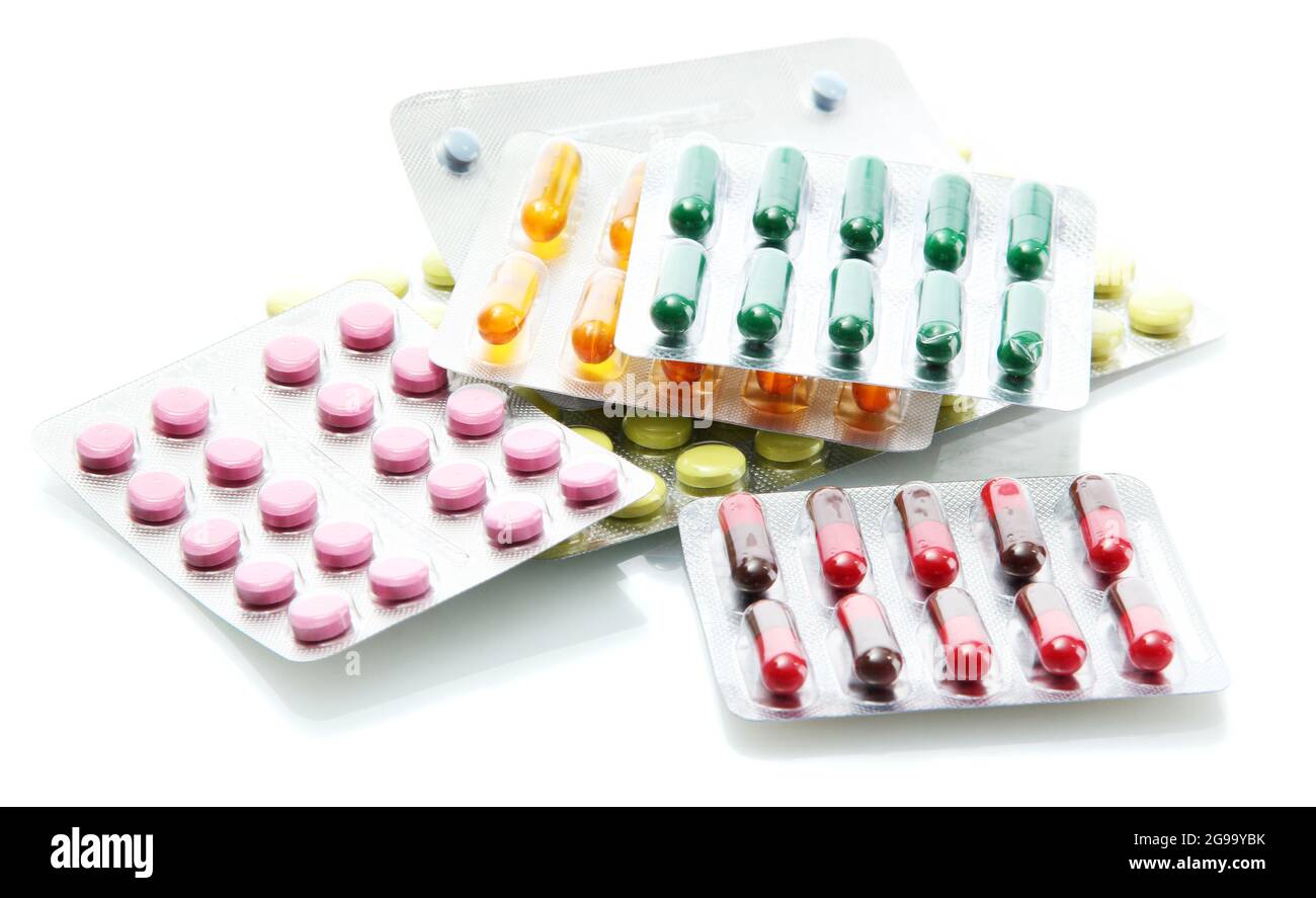 Capsules and pills packed in blisters, isolated on white Stock Photo - Alamy