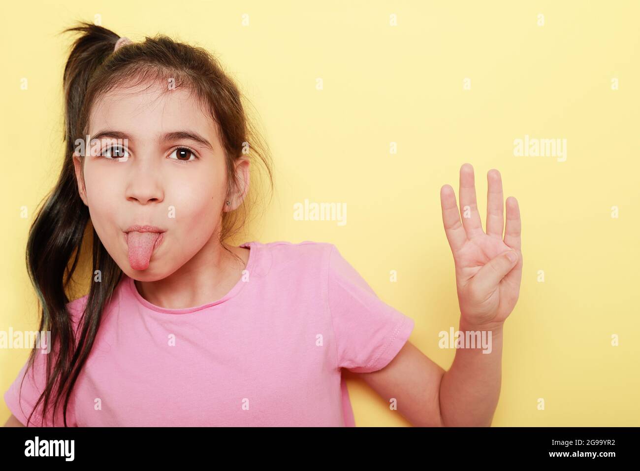 Girl showing four fingers hand hi-res stock photography and images - Alamy