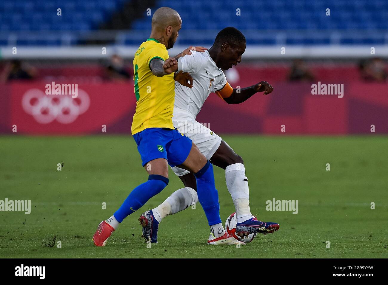 YOKOHAMA, JAPAN - JULY 25: Dani Alves of Brazil and Max Gradel of Ivory Coast during the Tokyo 2020 Olympic Mens Football Tournament match between Brazil and Ivory Coast at Nissan Stadium on July 25, 2021 in Yokohama, Japan (Photo by Pablo Morano/Orange Pictures) Stock Photo