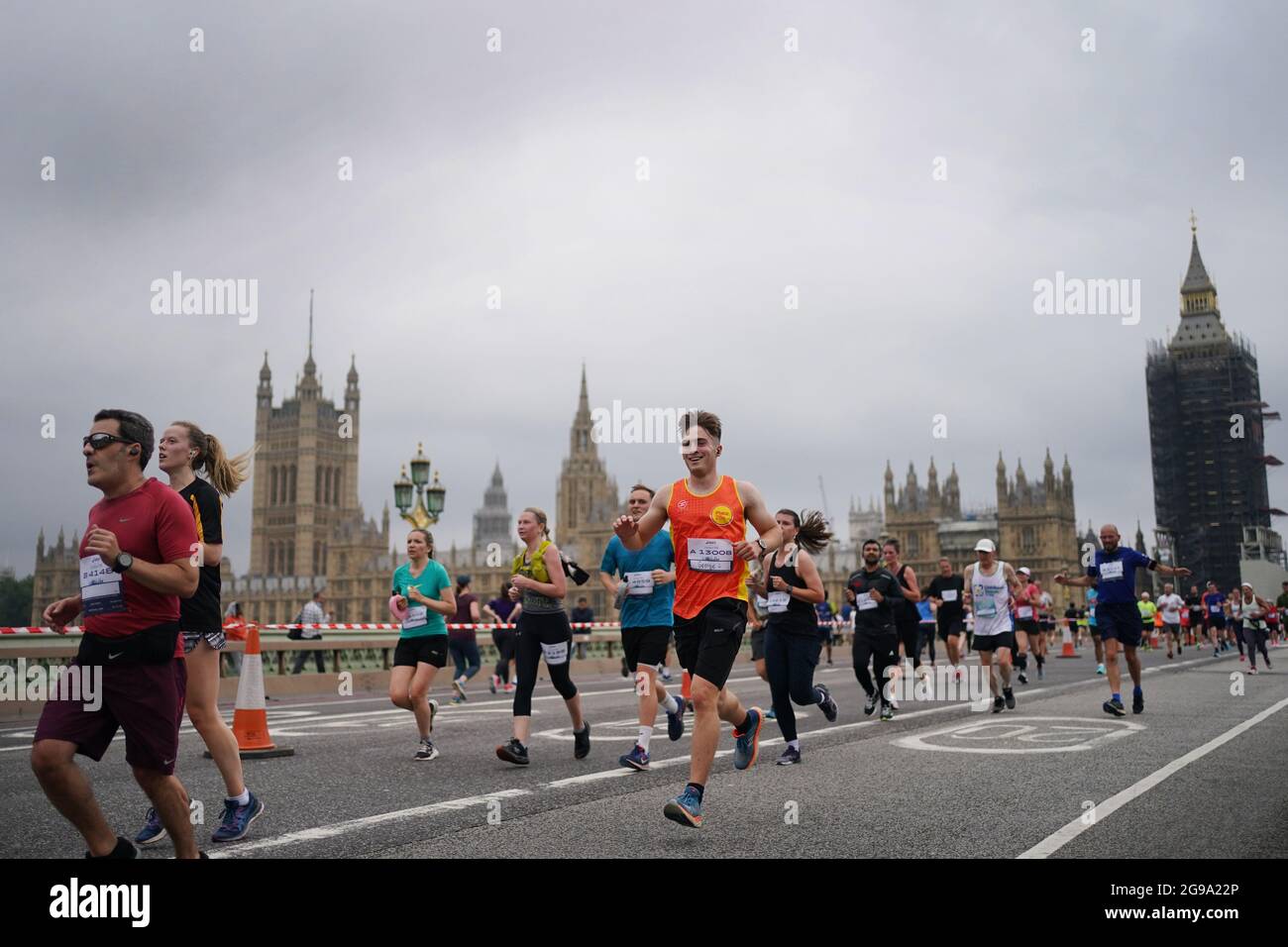 Runners cross Westminster Bridge in central London as they take part in the  Asics London 10k, thought to be the largest closed road running event in  London since the March 2020 lockdown.