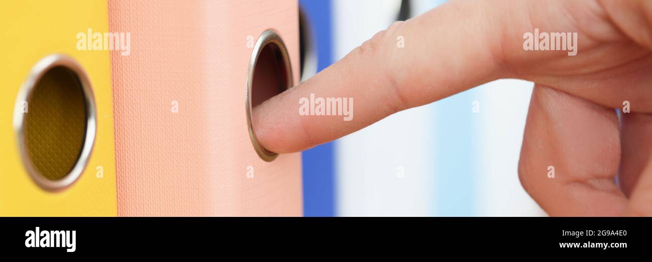 Woman's hand takes out folder with documents Stock Photo - Alamy