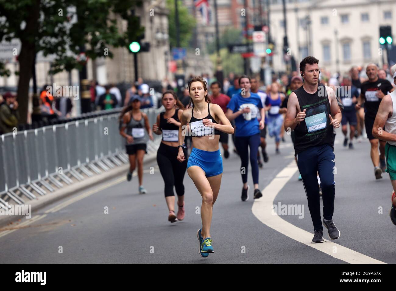 London, England, UK. 25th July, 2021. Runners in central London during the Asics  London 10K. The run is thought to be the largest closed road event since  the start of the coronavirus