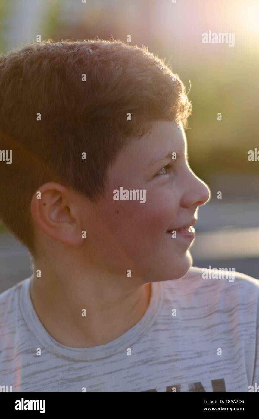 portrait of a teenager close-up at sunset time Stock Photo