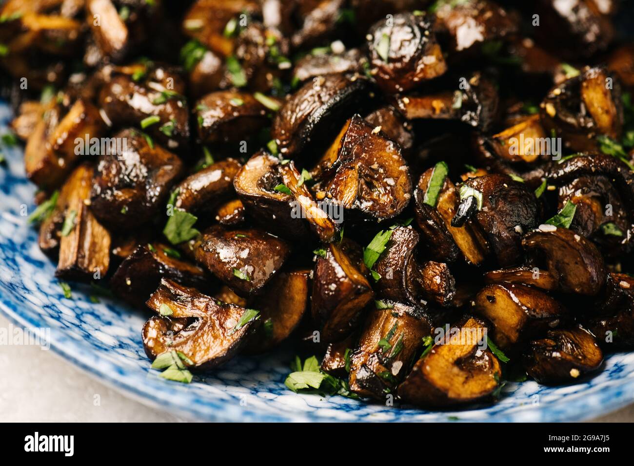 Marinated and roasted cremini mushrooms Stock Photo