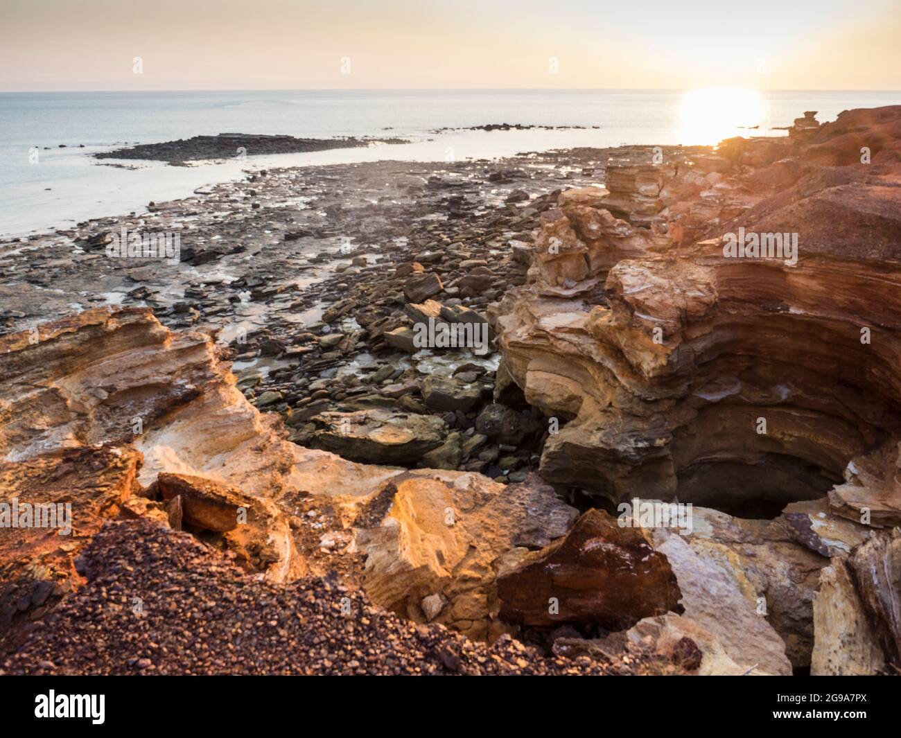 Indian Ocean sunset off rocky Reddell Beach, Broome, Kimberley, Western Australia Stock Photo