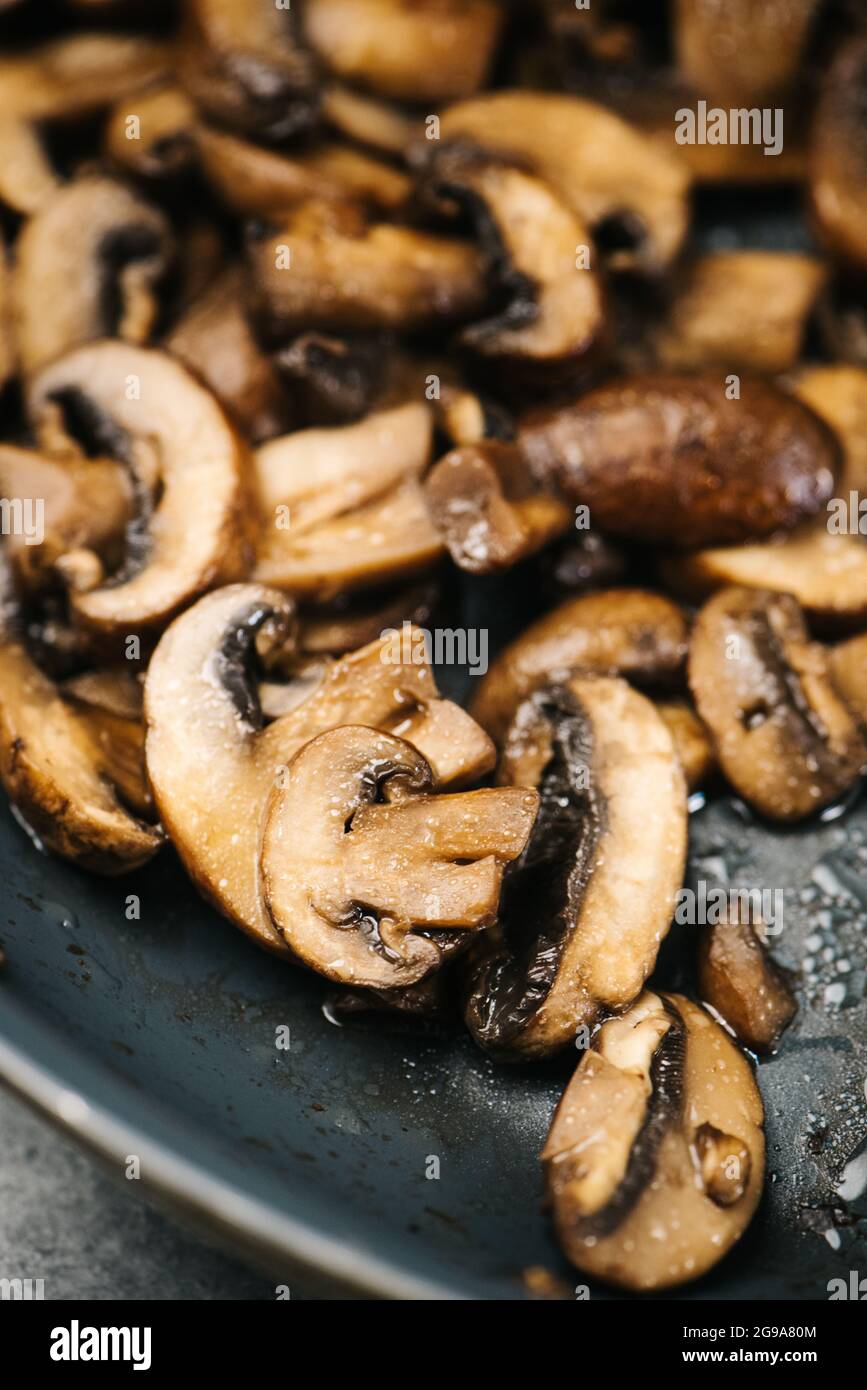 Closeup of sauteed cremini mushrooms in a frying pan Stock Photo Alamy