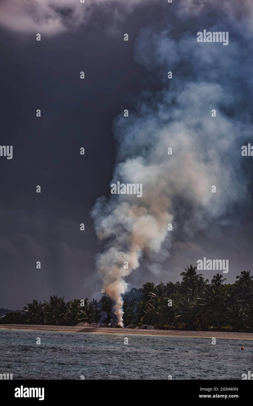 Smoke at tropical beach, Maldives Stock Photo Alamy
