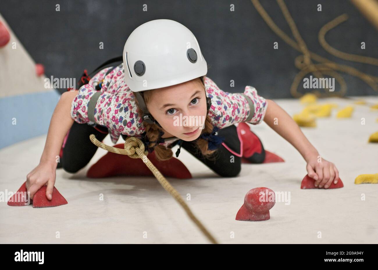 girl climbing at indoor climbing wall in London Stock Photo