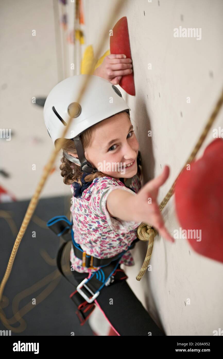 girl climbing at indoor climbing wall in London Stock Photo