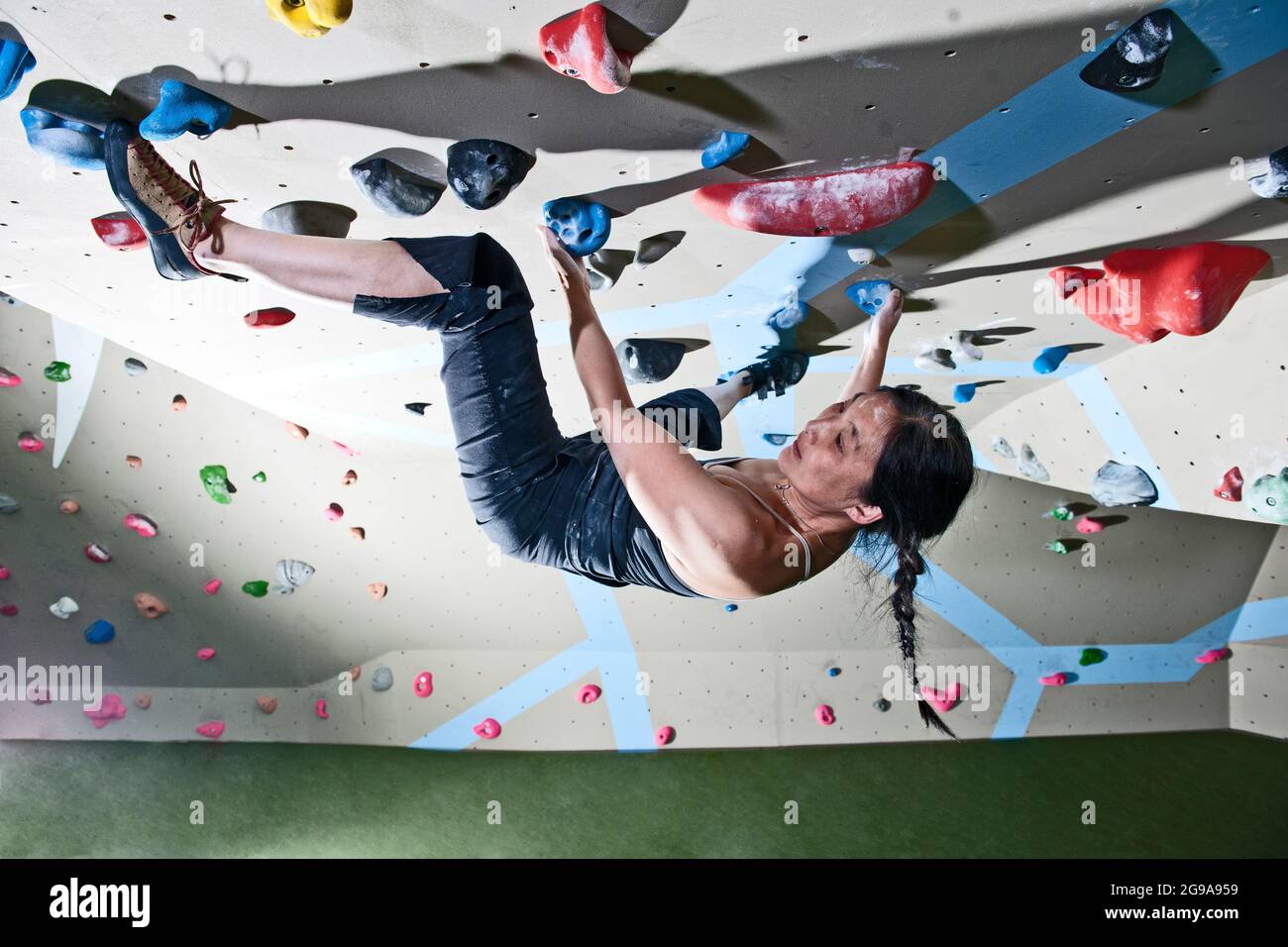 climber bouldering at indoor climbing wall in London Stock Photo Alamy