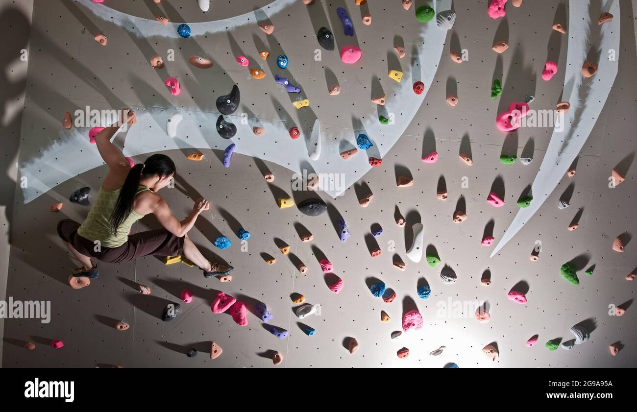 climber bouldering at indoor climbing wall in London Stock Photo Alamy