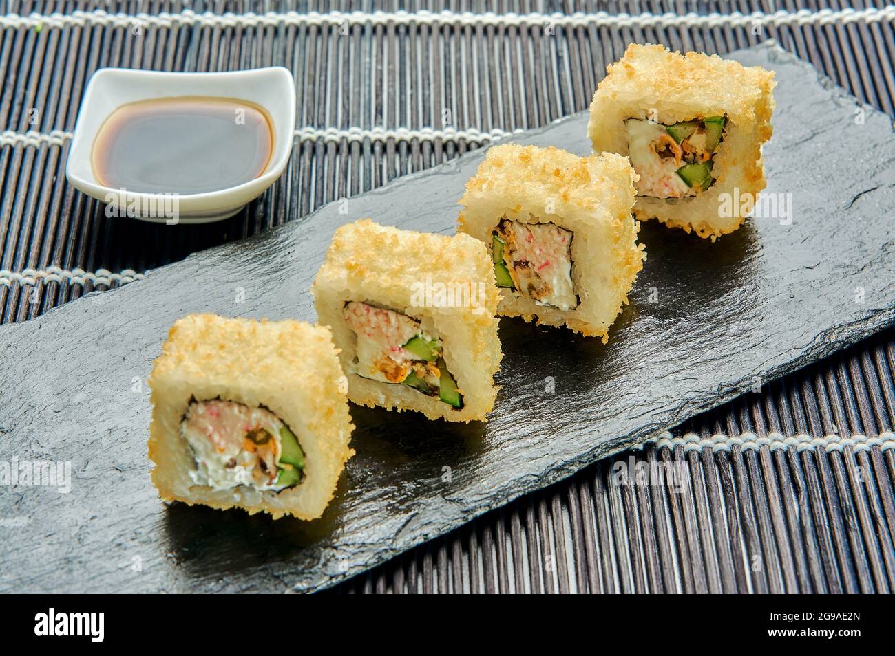 Hot rolls with mussels on a stone stand. Japanese cuisine Stock Photo