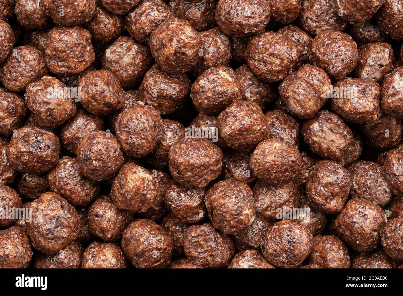 Chocolate breakfast cereal texture. Cereal balls as background