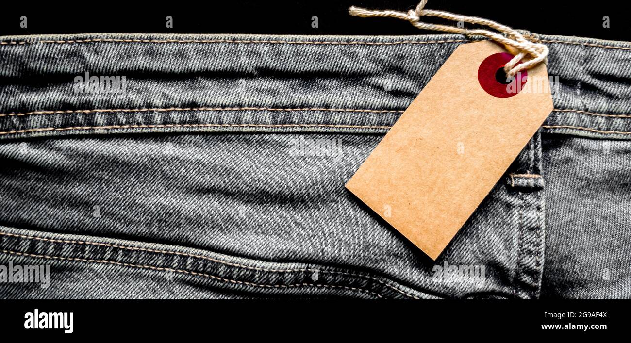 Blank white card on jeans background template Stock Photo - Alamy