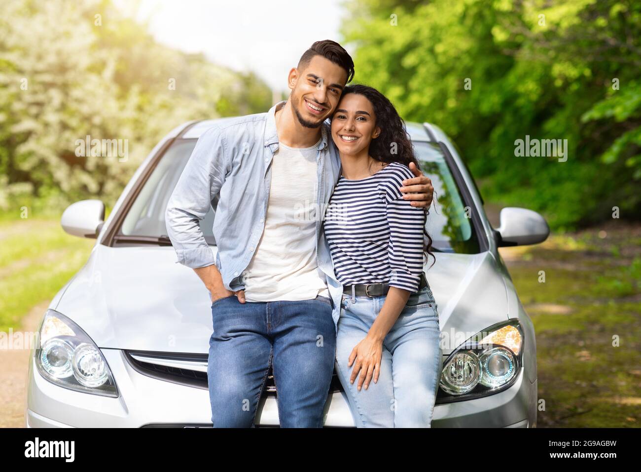 Young Couple Sitting On Bonnet Parked Stock Photo 215278807