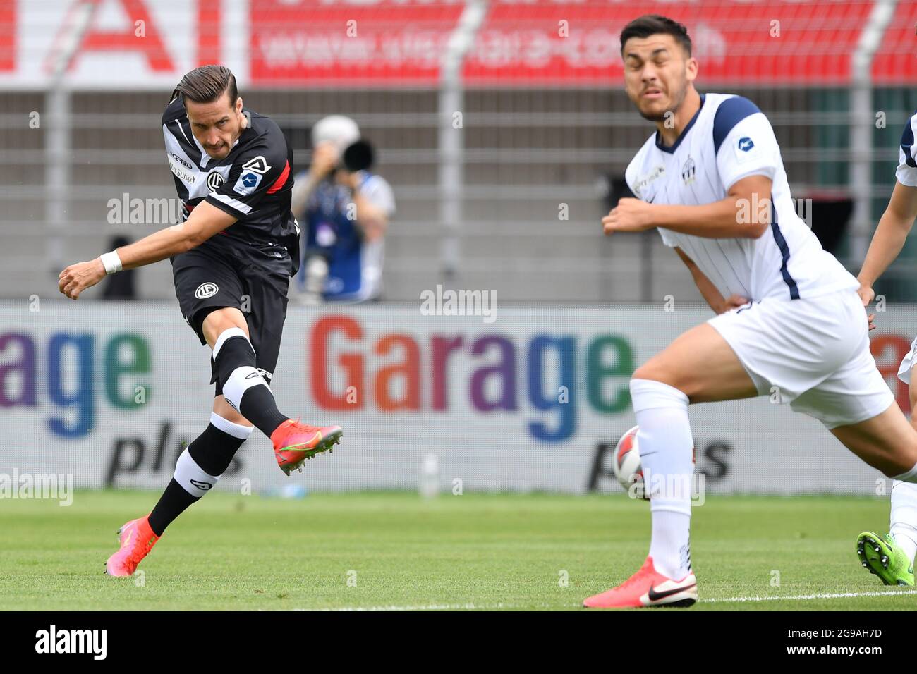 Lugano, Switzerland. 25th July, 2021. Mikael Facchinetti (#7 FC Lugano) and  Nikola Boranijasevic (#19 FC Zuerich) during the Super League match between FC  Lugano and FC Zuerich at Cornaredo Stadium in Lugano