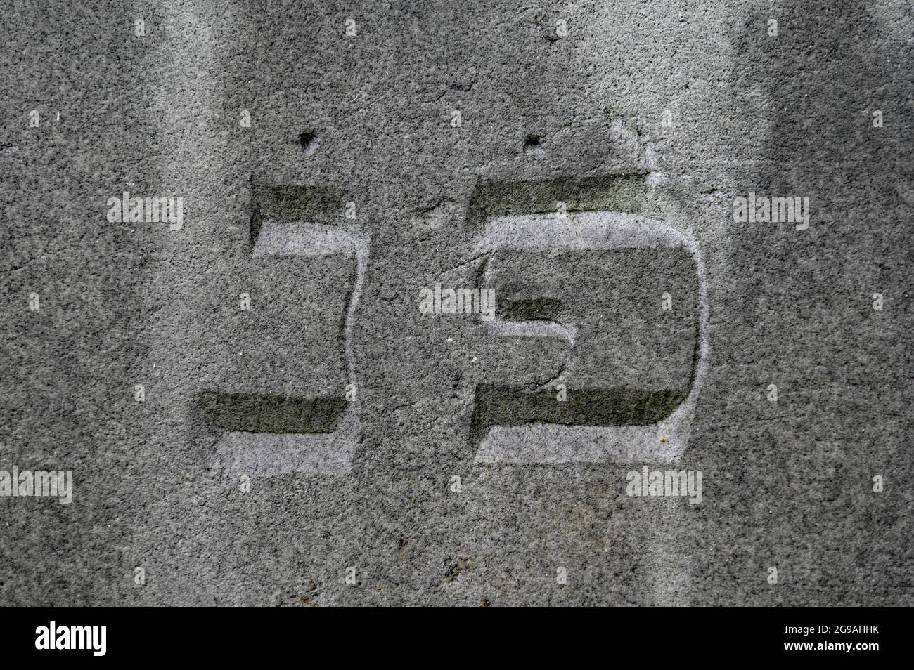 Hebrew characters on a grave with the meaning Here is buried Stock