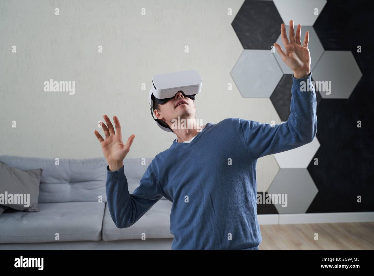 Man is using virtual reality headset. Concept of virtual reality, simulation, gaming and future technology. Stock Photo