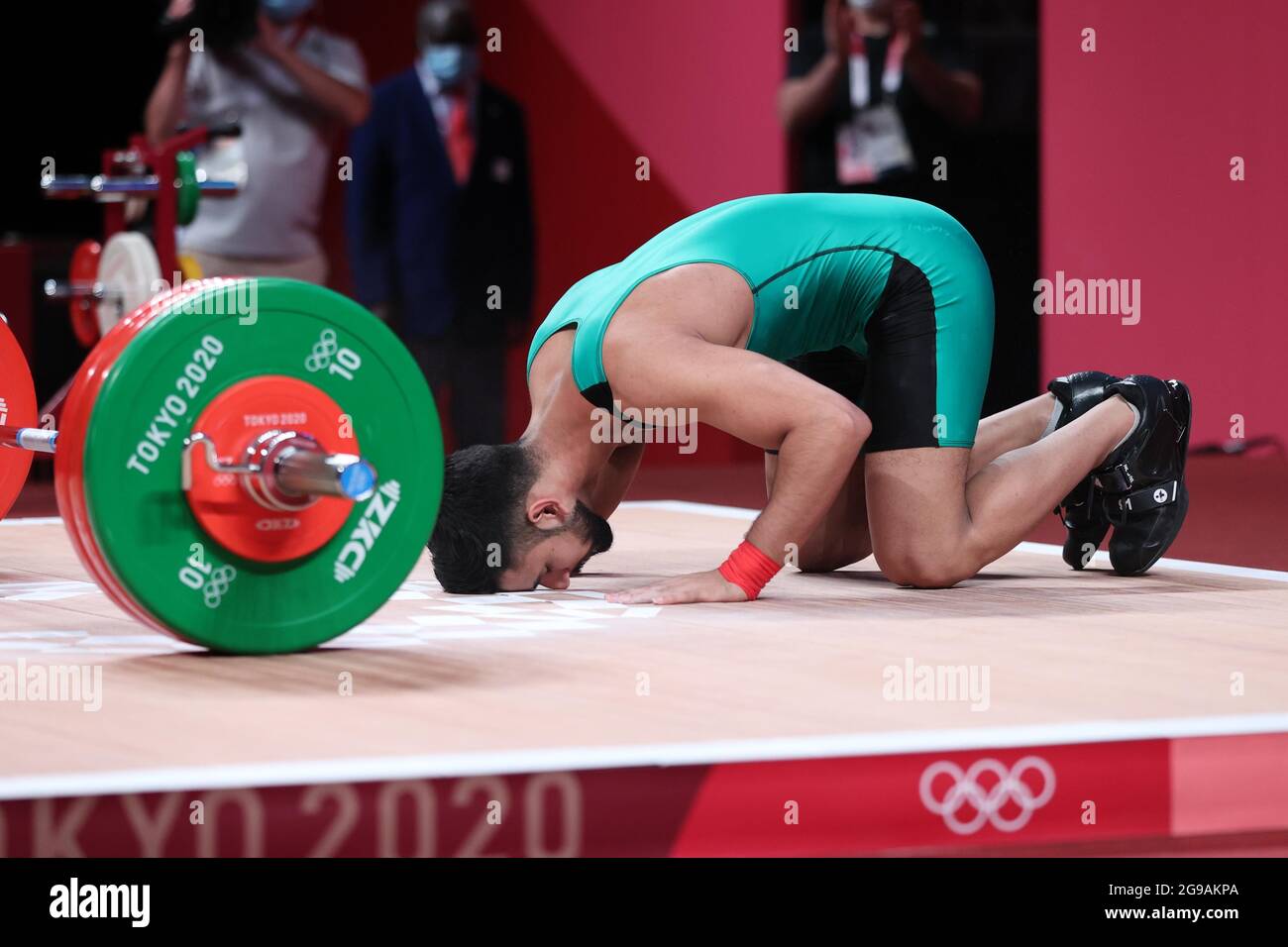 (210725) -- TOKYO, July 25, 2021 (Xinhua) -- Talha Talib of Pakistan reacts during the men's 67kg weightlifting event of the Tokyo 2020 Olympic Games in Tokyo, Japan, July 25, 2021. (Xinhua/Yang Lei) Stock Photo