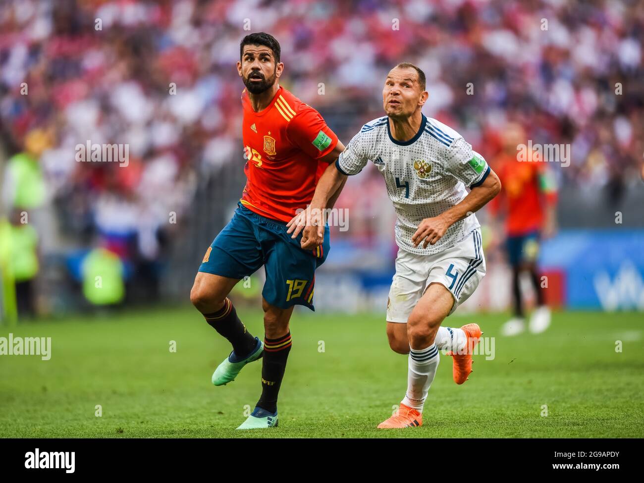 Moscow, Russia - July 1, 2018. Spain national football team striker Diego Costa and Russia defender Sergei Ignashevich during FIFA World Cup 2018 Roun Stock Photo