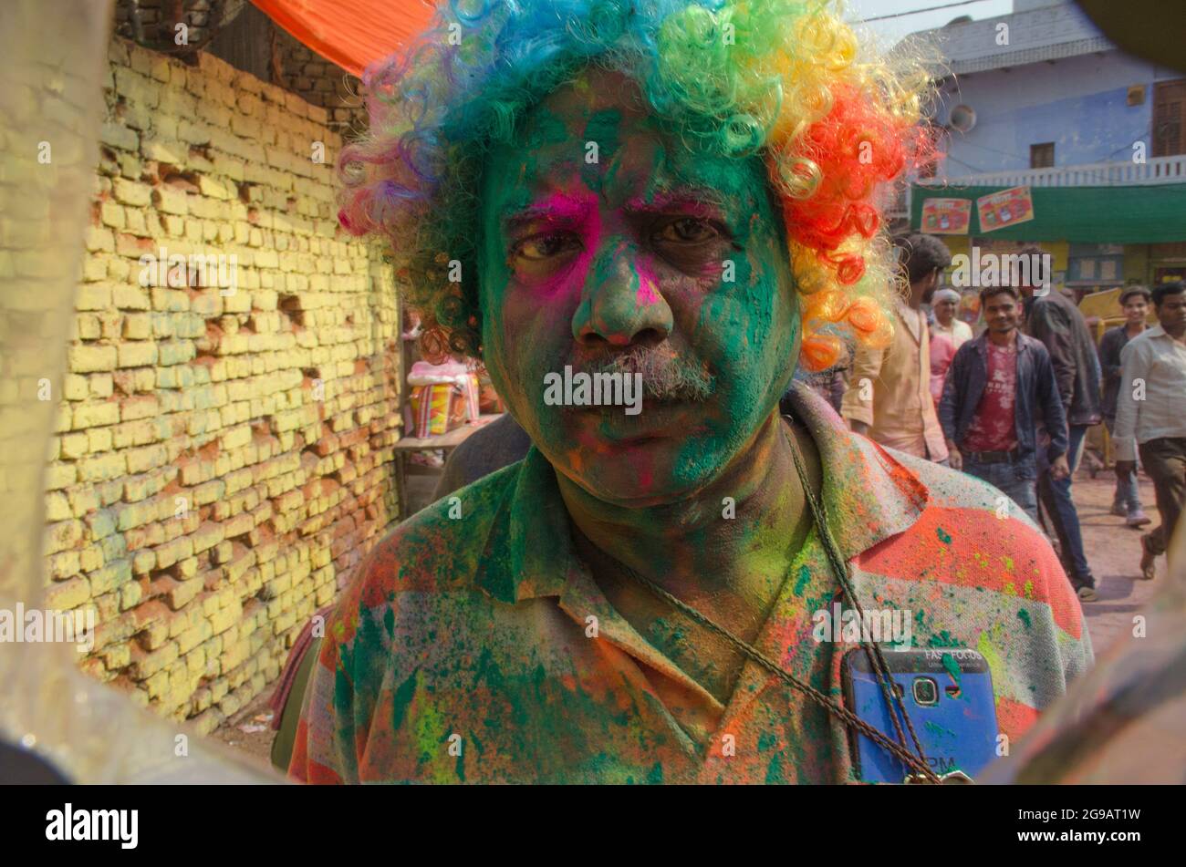 A colorful portrait of a devotee in a lane of Mathura in India. Stock Photo