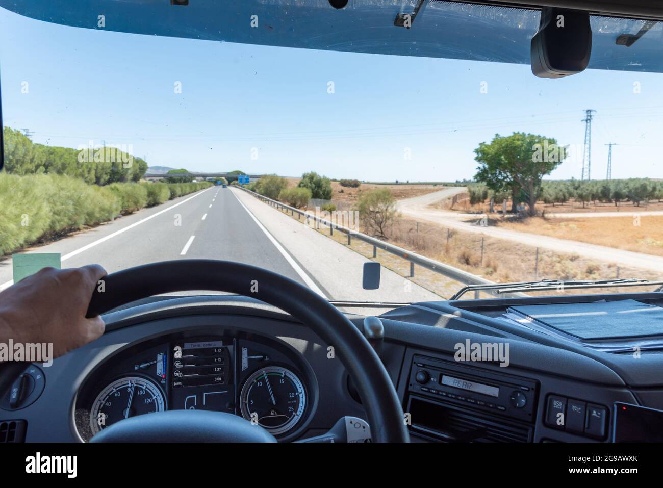 Panoramic view from inside a truck driving on a highway. Stock Photo