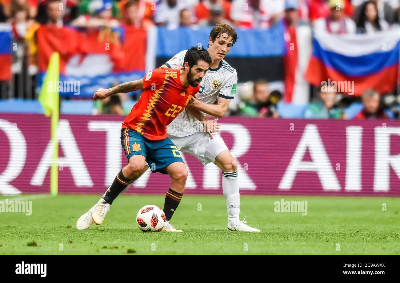 Moscow, Russia - July 1, 2018. Spain national football team midfielder Isco against Russia defender Mario Fernandes during FIFA World Cup 2018 Round o Stock Photo