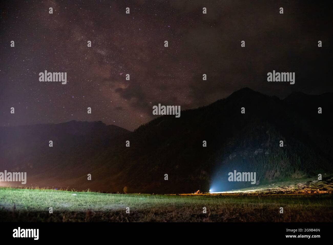 A view of Milky Way in the sky past mountains in Dawar, Gurez. (Photo by Idrees Abbas / SOPA Images/Sipa USA) Stock Photo