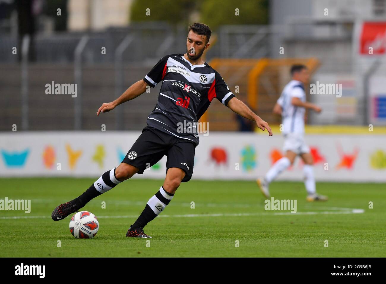 Lugano, Switzerland. 25th July, 2021. Mikael Facchinetti (#7 FC Lugano) and  Nikola Boranijasevic (#19 FC Zuerich) during the Super League match between FC  Lugano and FC Zuerich at Cornaredo Stadium in Lugano