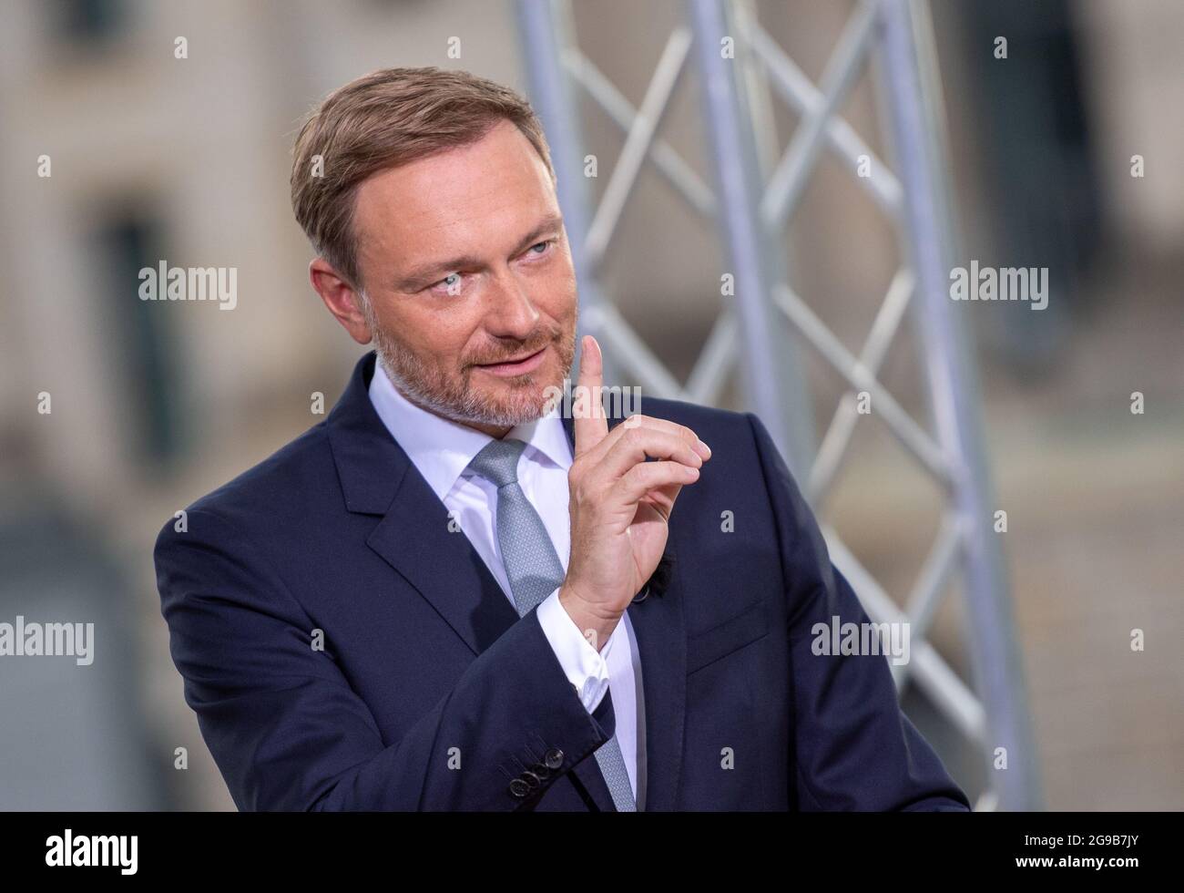 25 July 2021, Berlin: Christian Lindner, party leader of the FDP, speaks at the ARD summer interview on the terrace of the Marie-Elisabeth-Lüders-Haus. Photo: Christophe Gateau/dpa Stock Photo