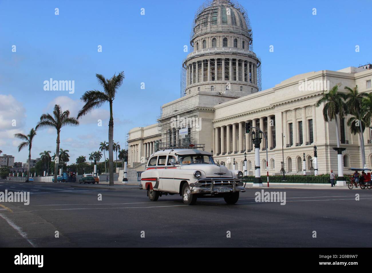 Chevrolet station wagon outside of El Capitolio, Havana, Cuba Stock Photo