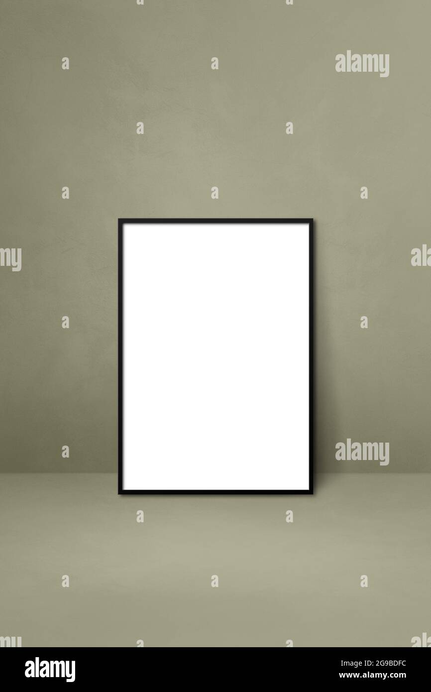 Black picture frame leaning on a grey wall. Blank mockup template Stock ...