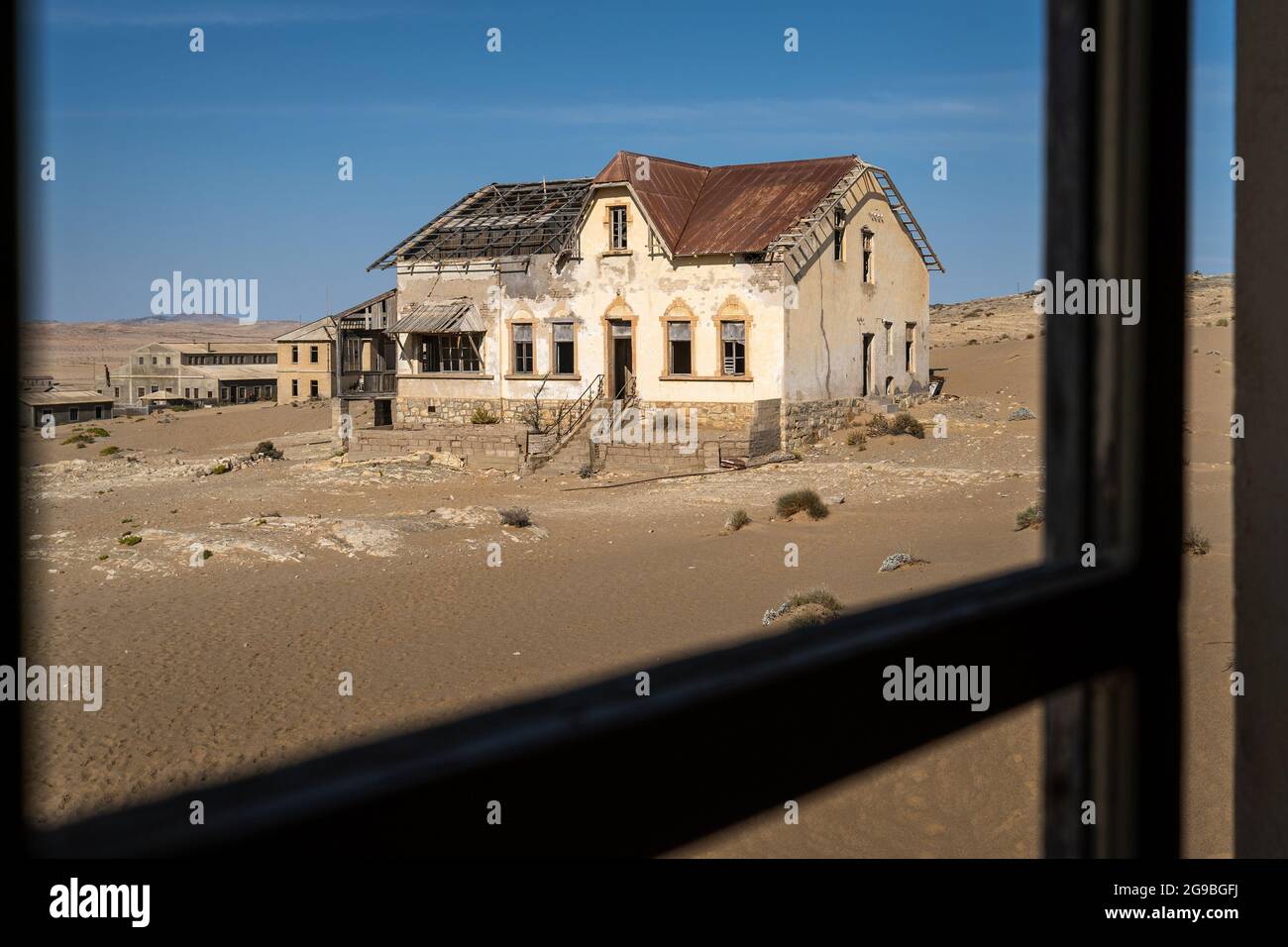 Abandoned building in the ghost town of Kolmanskop near Luderitz, Namib Desert, Namibia. Stock Photo