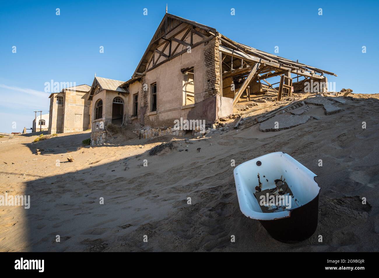 Abandoned buildings in Kolmanskop, a ghost town near Luderitz in the Namib Desert, Namibia, southwest Africa. Stock Photo