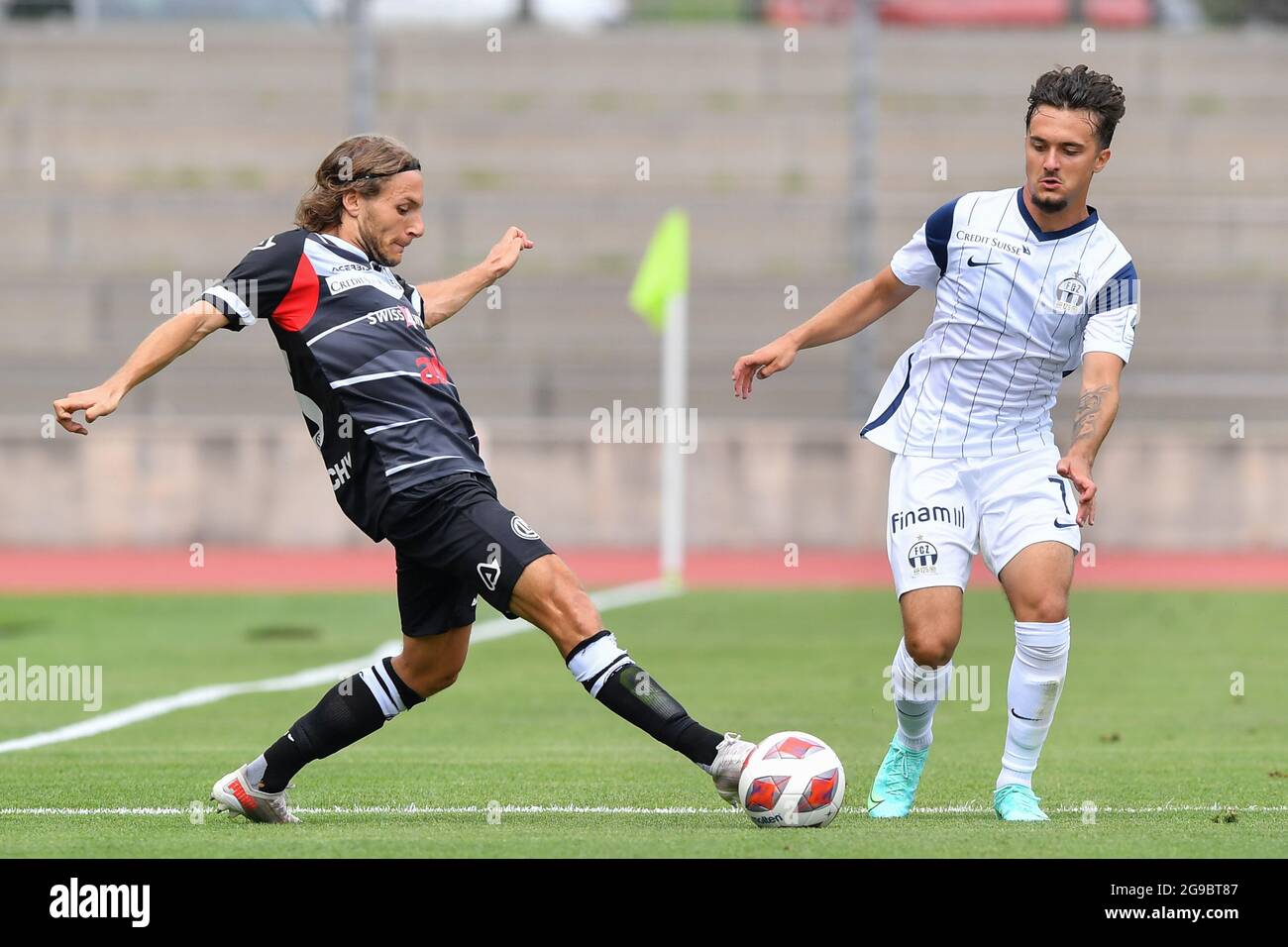 Lugano, Switzerland. 25th July, 2021. Mikael Facchinetti (#7 FC Lugano) and  Nikola Boranijasevic (#19 FC Zuerich) during the Super League match between FC  Lugano and FC Zuerich at Cornaredo Stadium in Lugano