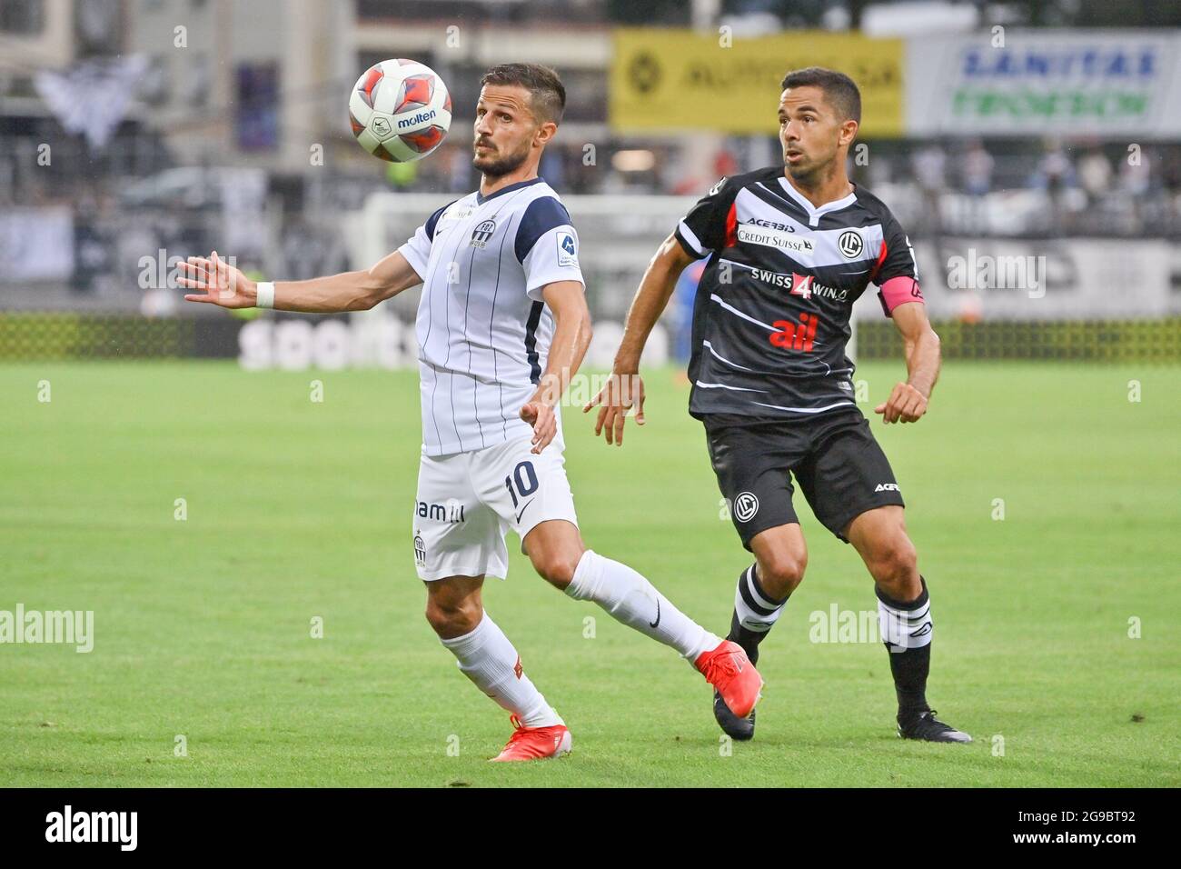 Lugano, Switzerland. 25th July, 2021. Mikael Facchinetti (#7 FC Lugano) and  Nikola Boranijasevic (#19 FC Zuerich) during the Super League match between FC  Lugano and FC Zuerich at Cornaredo Stadium in Lugano