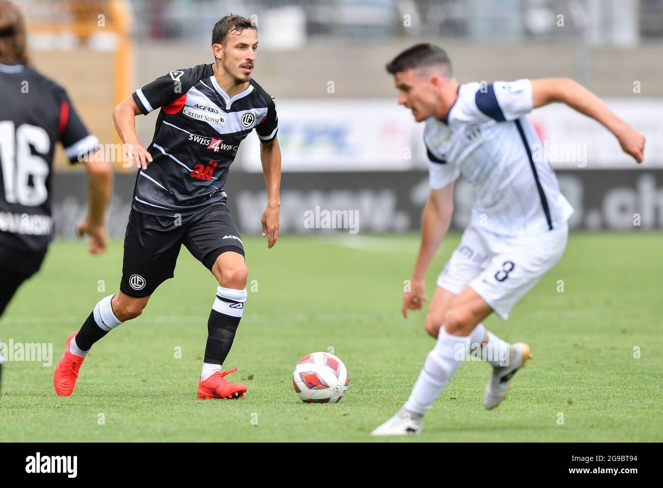 Lugano, Switzerland. 25th July, 2021. Antonio Marchesano (#10 FC Zuerich)  and Sandi Lovric (#24 FC Lugano) during the Super League match between FC  Lugano and FC Zuerich at Cornaredo Stadium in Lugano