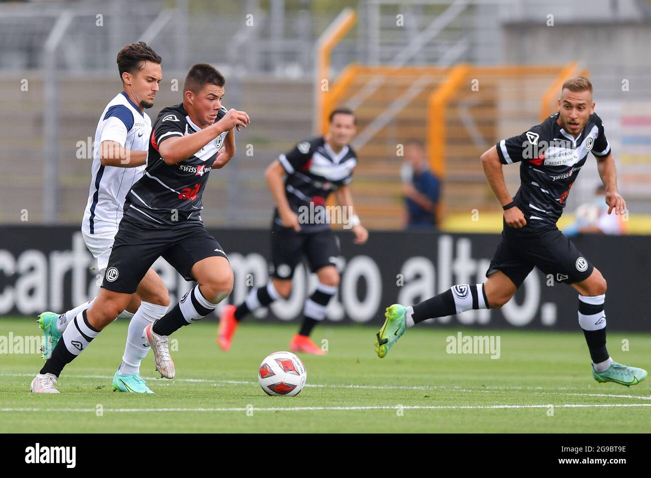 Lugano, Switzerland. 25th July, 2021. Mikael Facchinetti (#7 FC Lugano) and  Nikola Boranijasevic (#19 FC Zuerich) during the Super League match between FC  Lugano and FC Zuerich at Cornaredo Stadium in Lugano