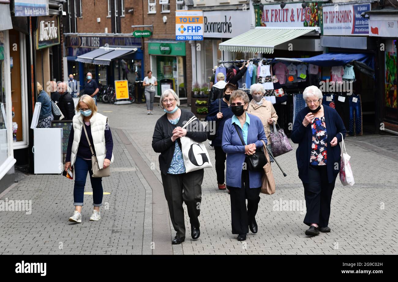 Ladies out shopping wearing Covid facemasks facemask in the main shopping street of Wellington, Telford, Shropshire, face mask masks coronavirus covid Stock Photo