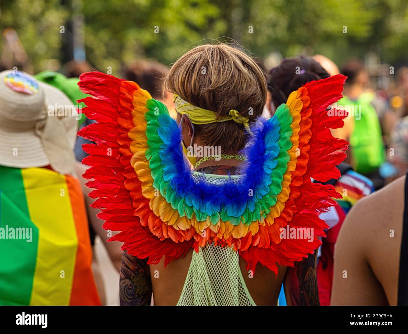 Berlin, Germany - July 24, 2021 - A man wears rainbow angel wings on Christopher Street Day (CSD) Stock Photo