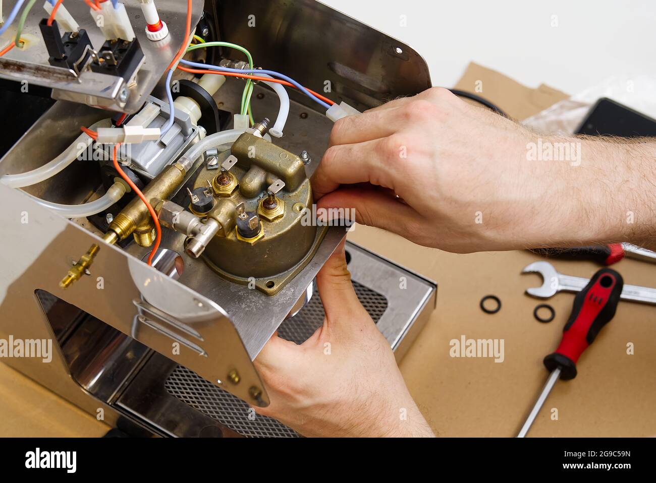 Repair of coffee machine. Spare parts for the espresso machine. Repair of  kitchen appliances Stock Photo - Alamy