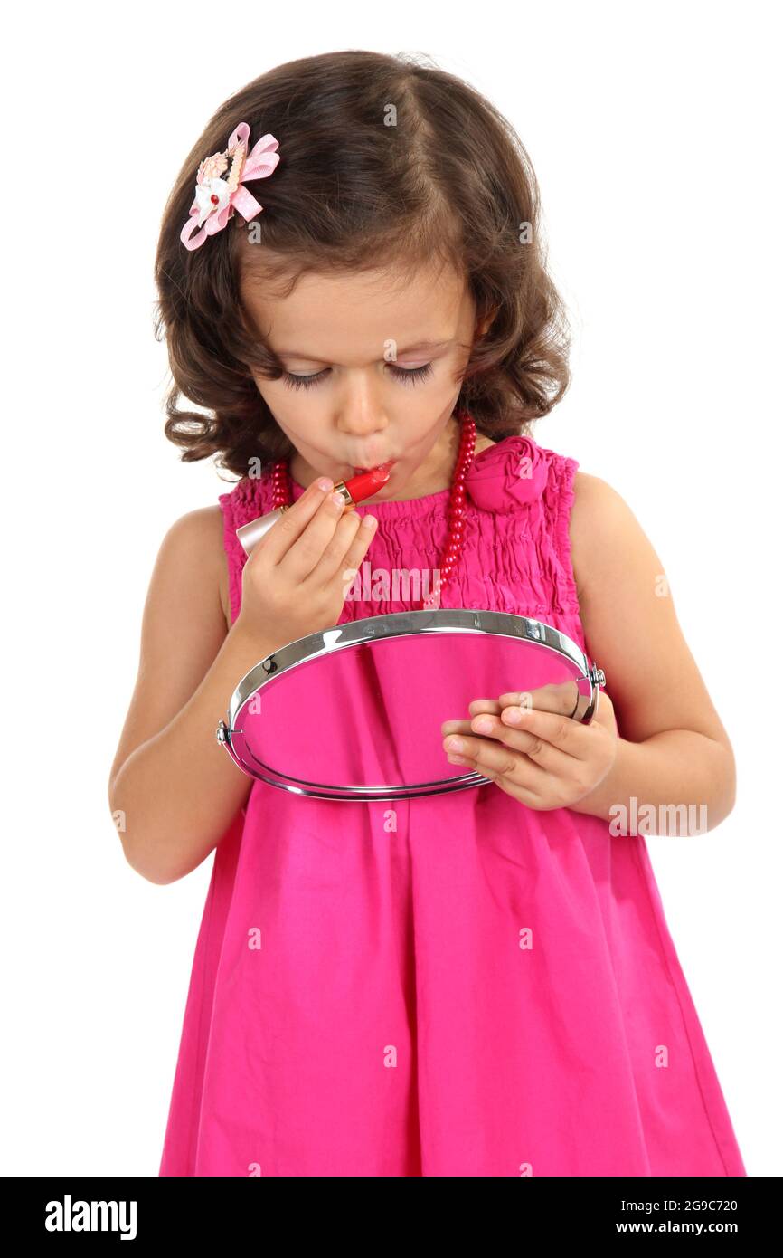 beautiful little girl doing makeup isolated on white Stock Photo Alamy
